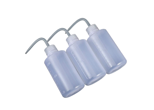 Set of three clear plastic bottles with a hose on a black background
