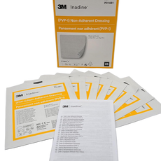A box of 3M Inadine Non-Adherent Antimicrobial Dressings, with several individually wrapped dressings displayed in front of the box.