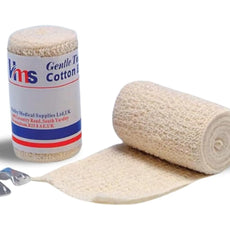 A roll of beige cotton bandage with a label that reads 'MS Cotton' and 'Gentle Elastic Bandage, 5cm x 4.5m' alongside a pair of metal medical scissors.